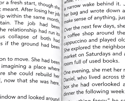 An open book with very narrow gutter margins. 