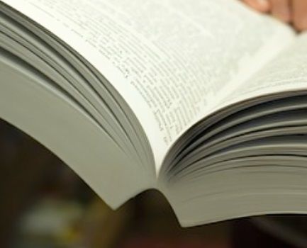 A close up of a thick book bound with PUR glue 
