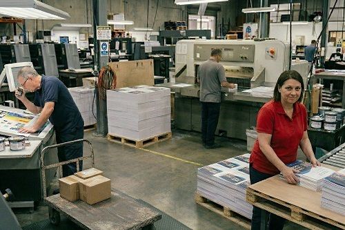 Production equipment and employees of a commercial printing company