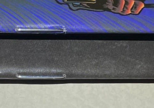 Close-Up of two saddle stitched comic book spines