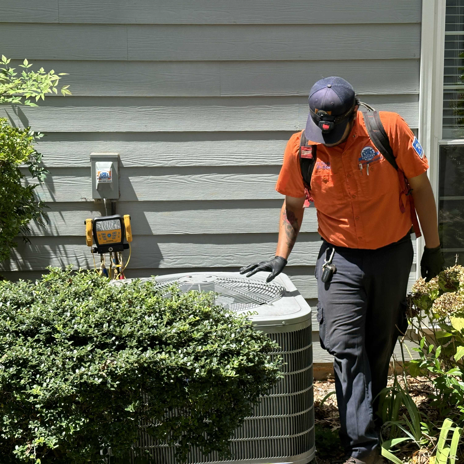 Estes Services Tech performing a Tune-UP 