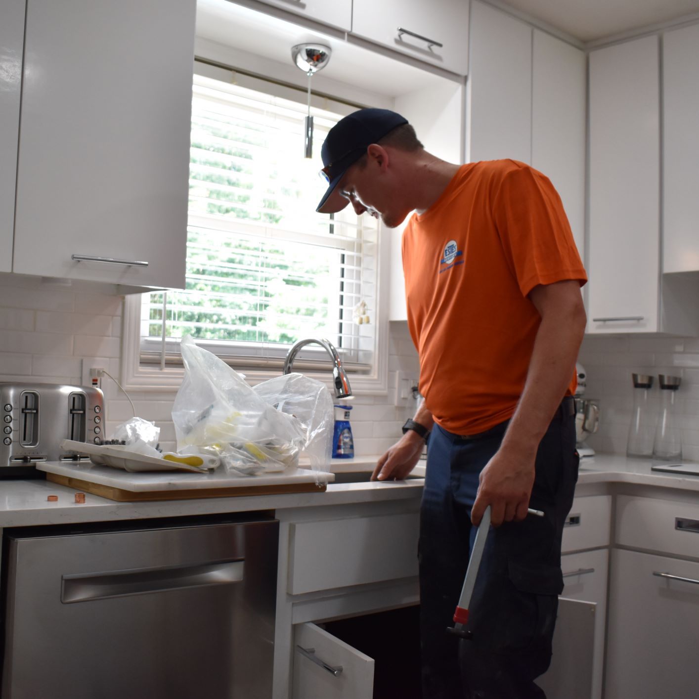 Estes Plumber is installing new kitchen fixtures 