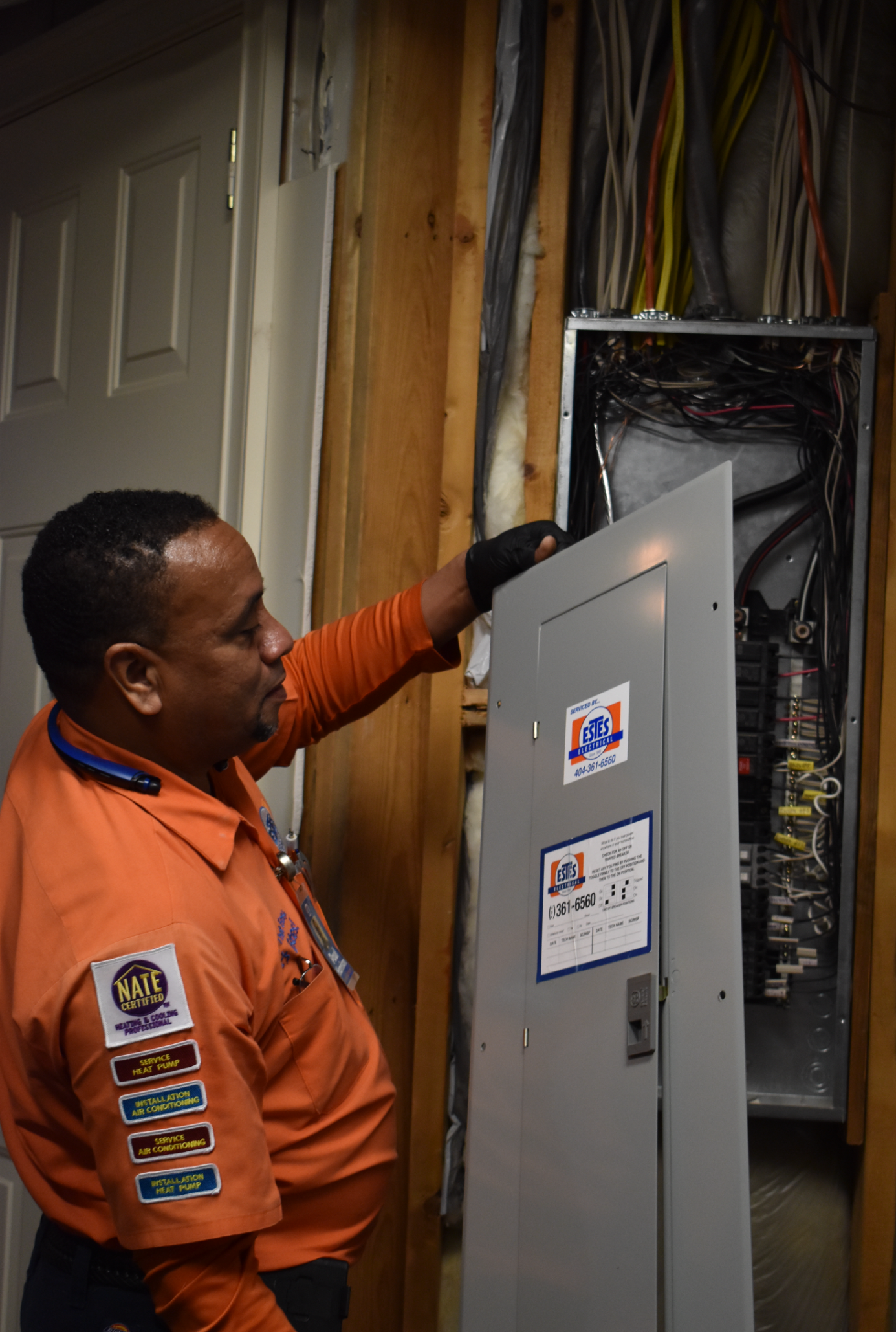 Estes Electrician holding an electrical panel