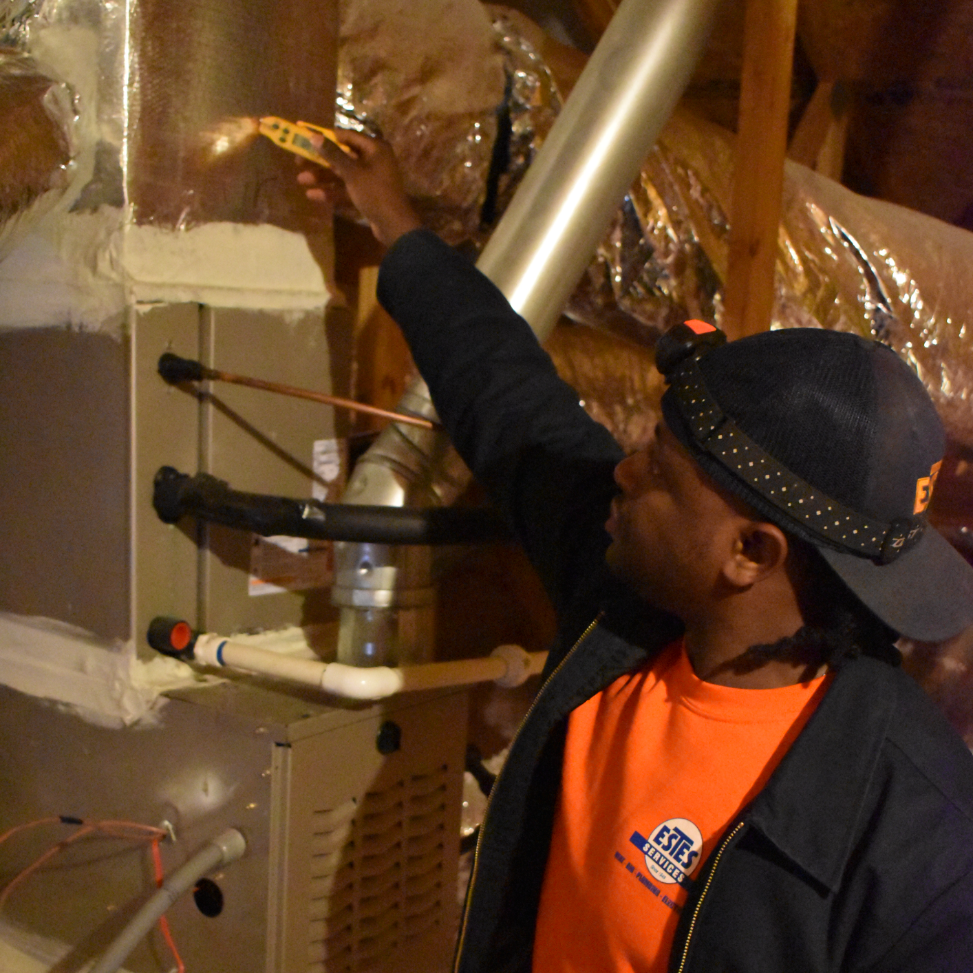 Estes Services HVAC Technician with a Furnace in an Attic 