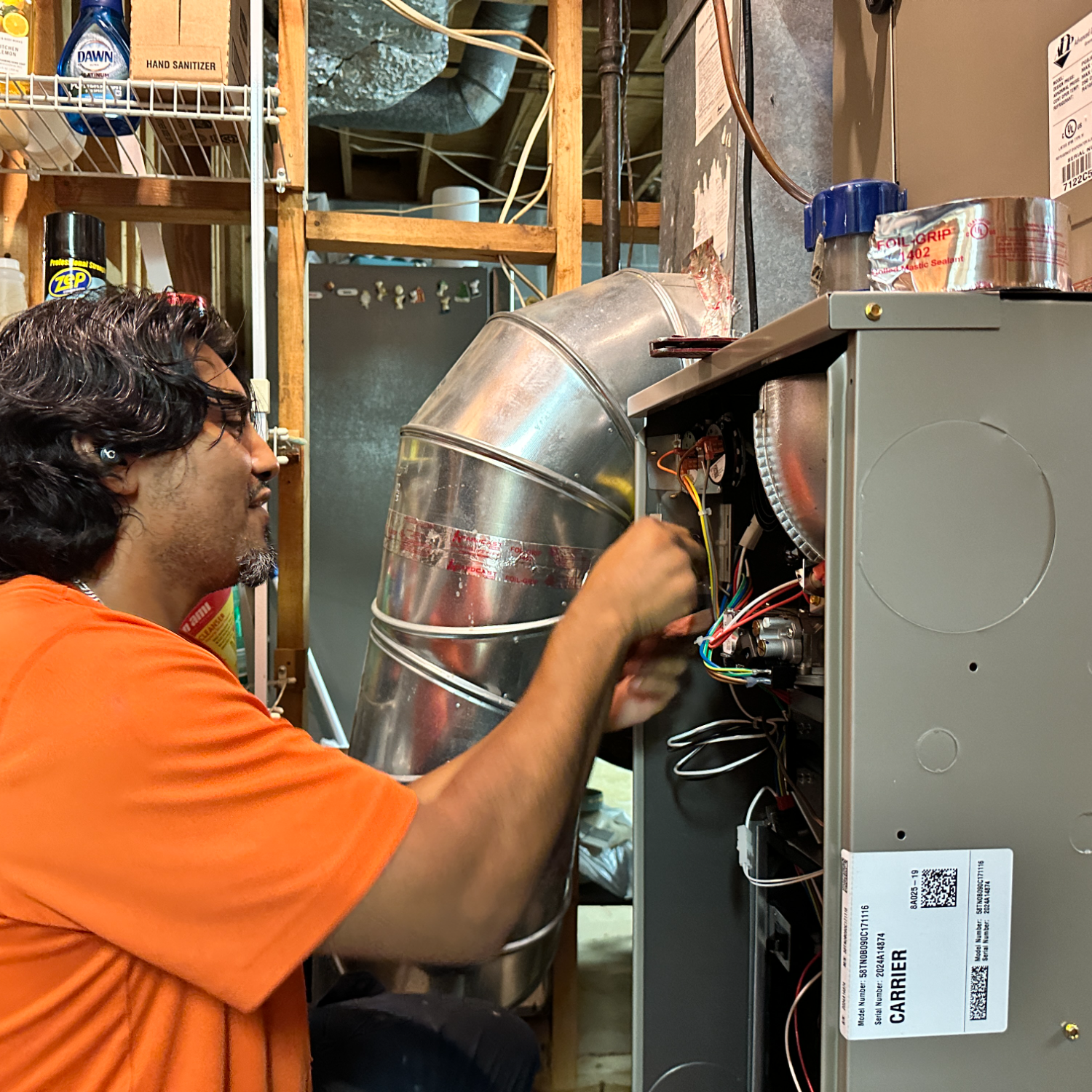 Estes Services professional installing a Carrier furnace