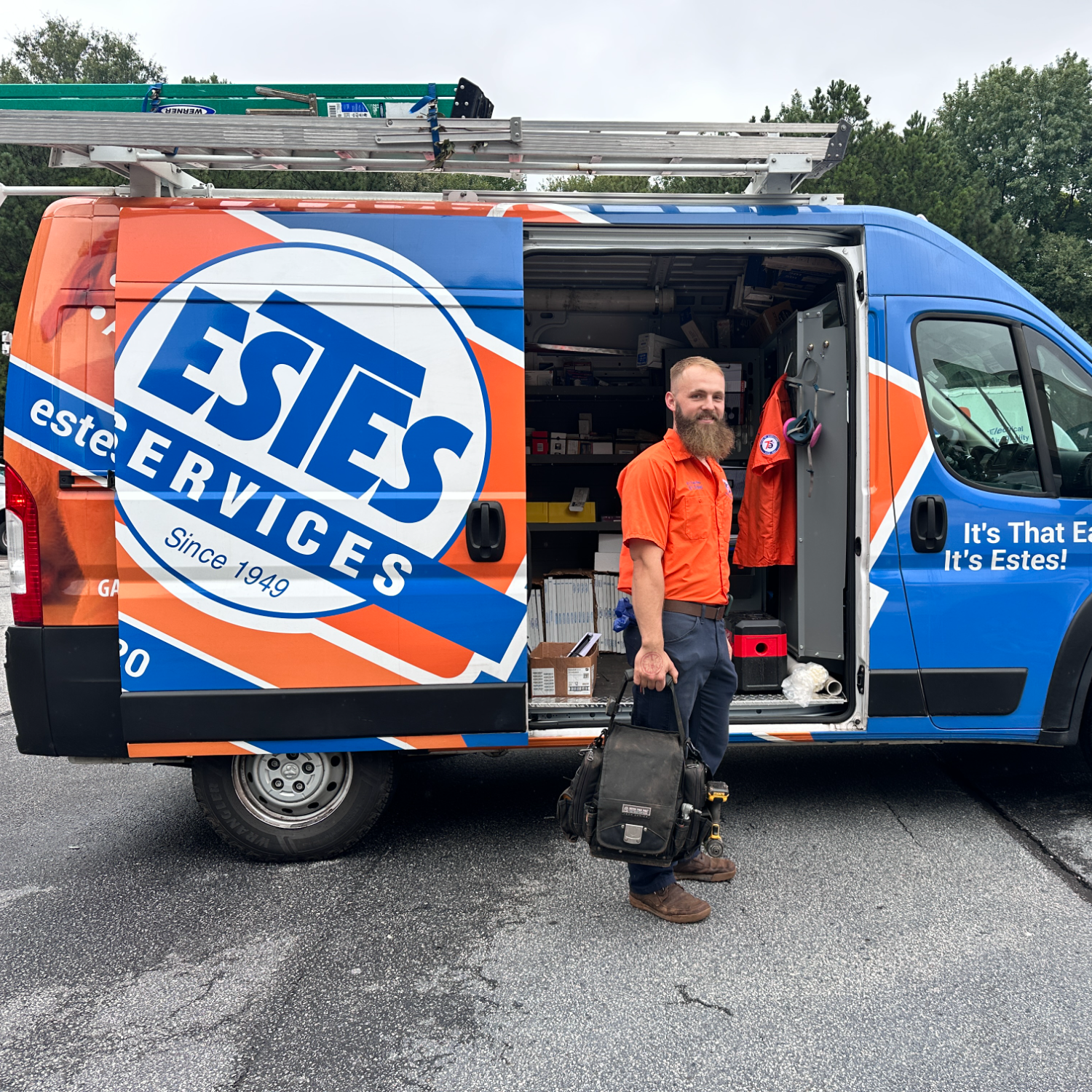 Estes HVAC Tech in front of an Estes Branded Truck