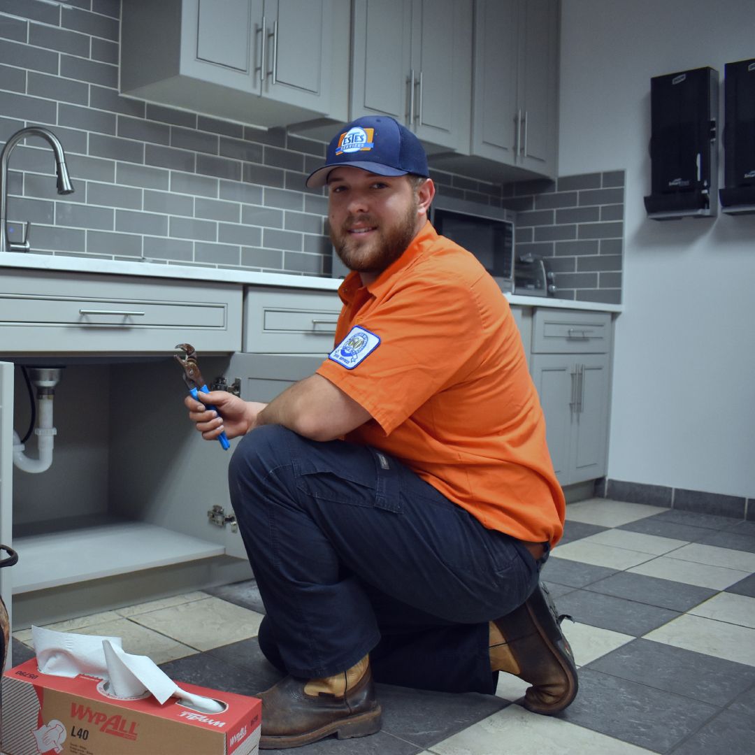 Estes Plumber cleaning drainage in a kitchen