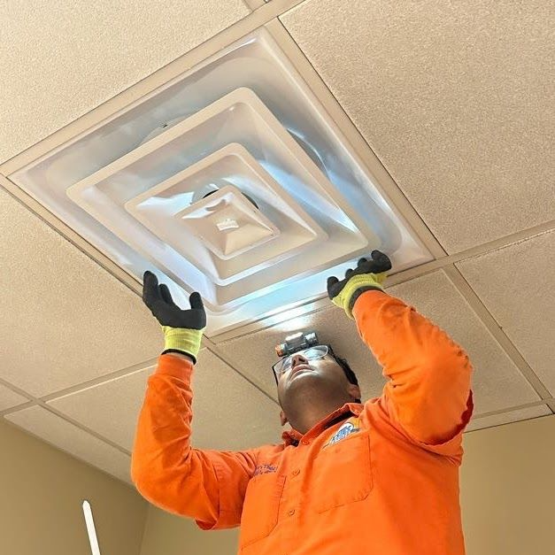 Estes technician performing HVAC tune-up in Atlanta