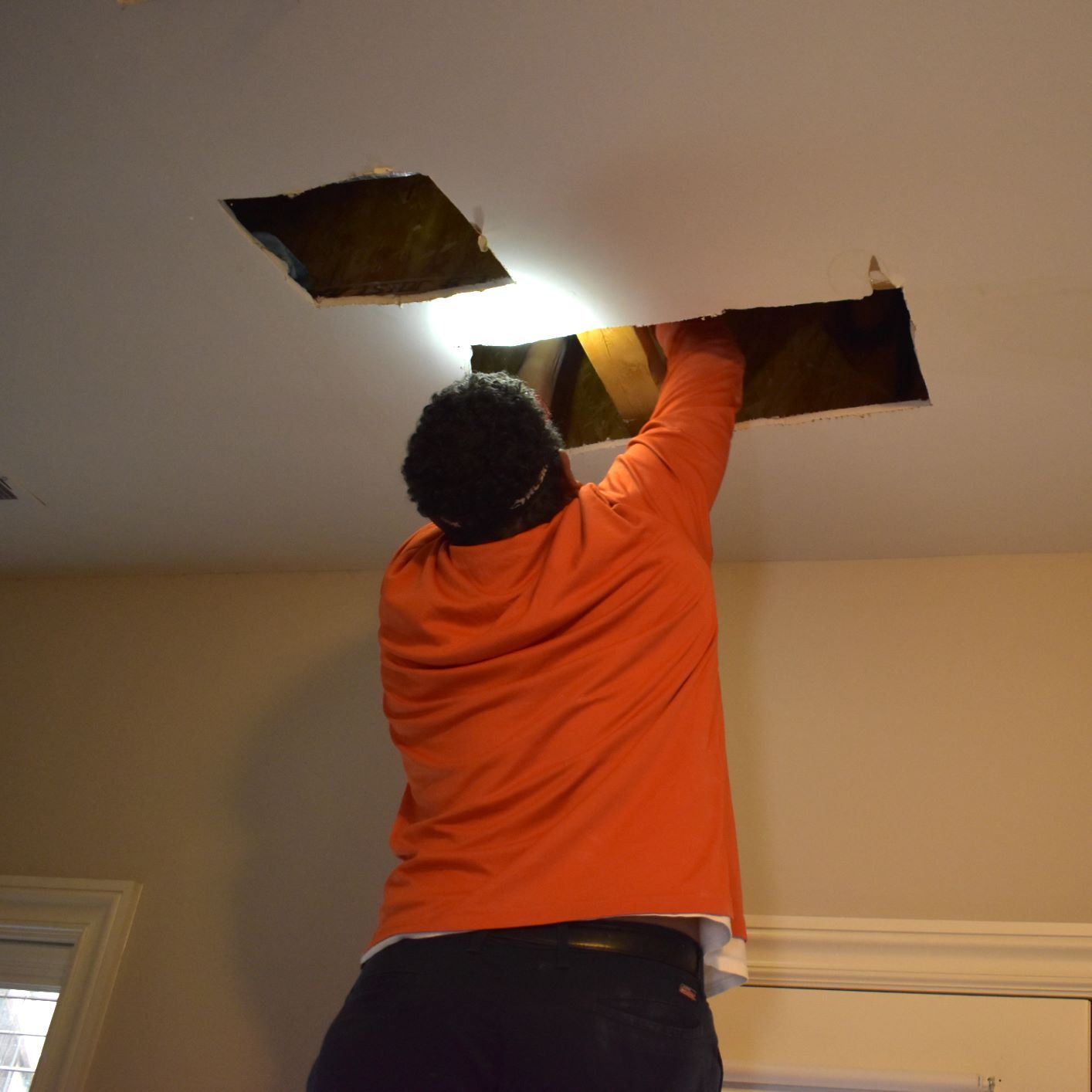 Estes Plumber Fixing a Water Leak in a Ceiling 