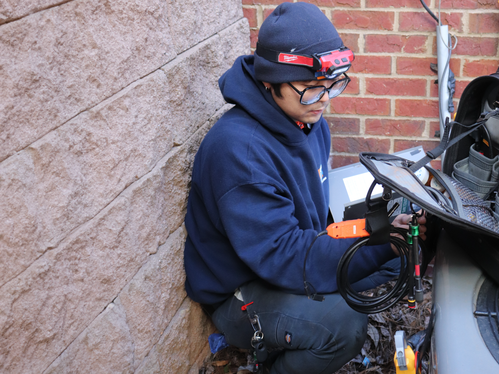 Estes Technician working on outside hvac unit