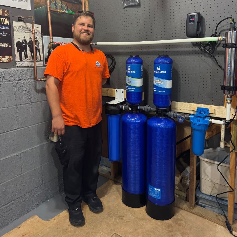 Estes Services Plumber in front of a just installed Water Filtration System