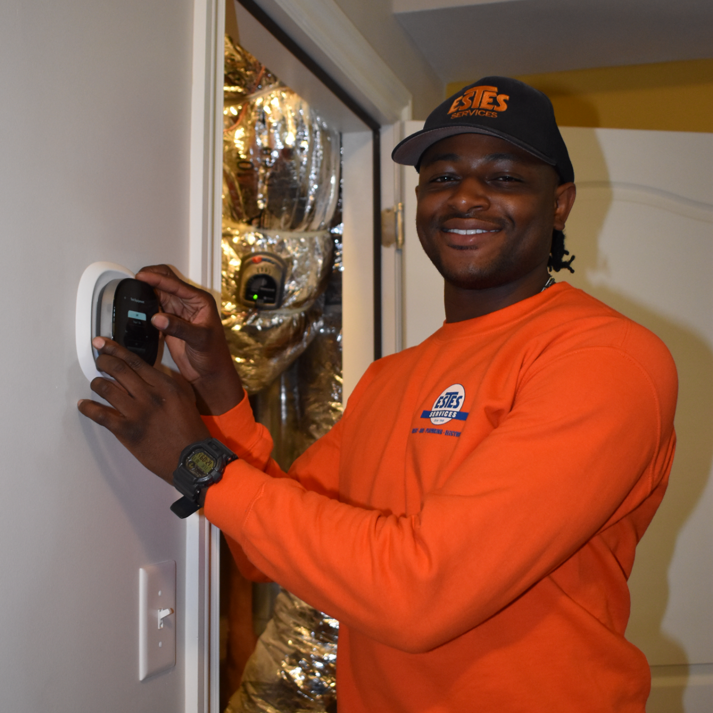 Estes Heating Technician near a Ecobee Thermostat