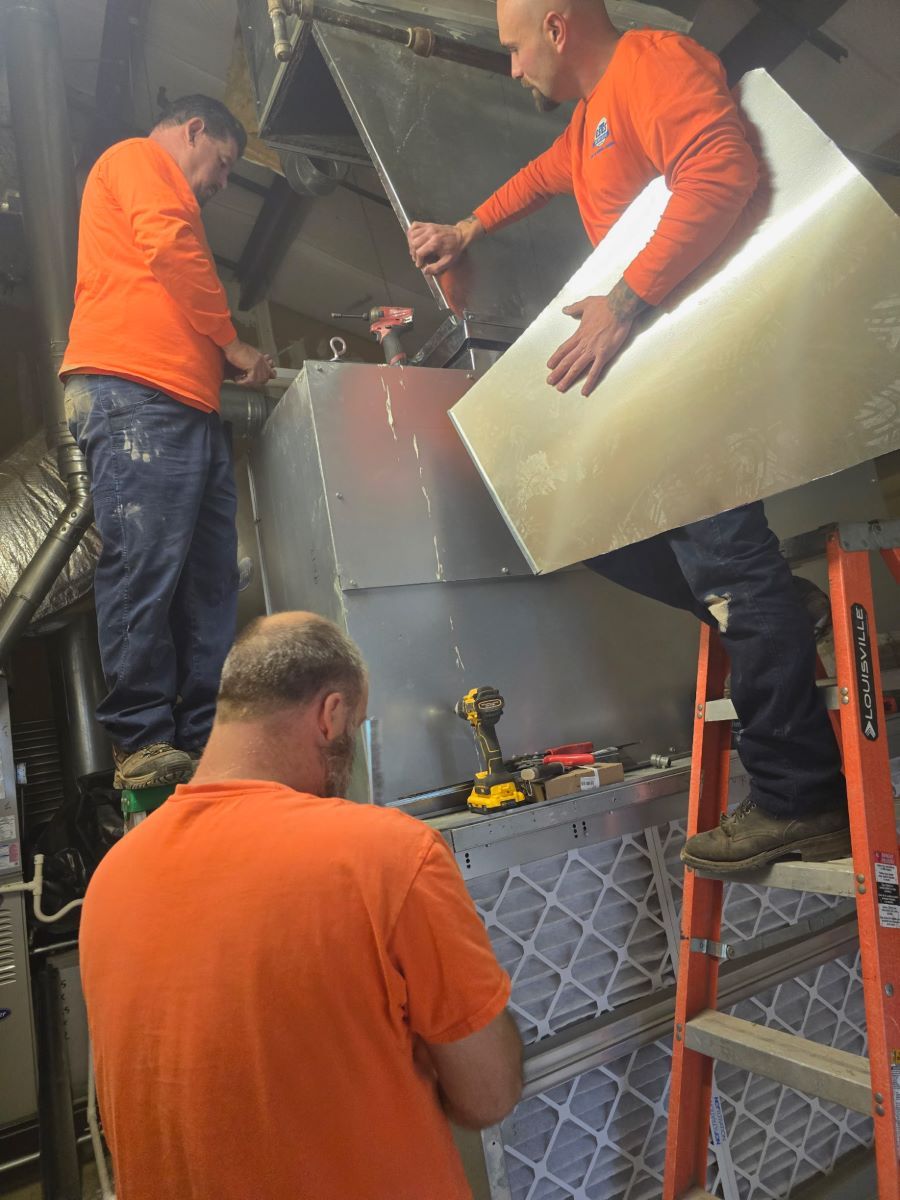 Estes Commercial HVAC Professionals installing a HVAC equipment in a School