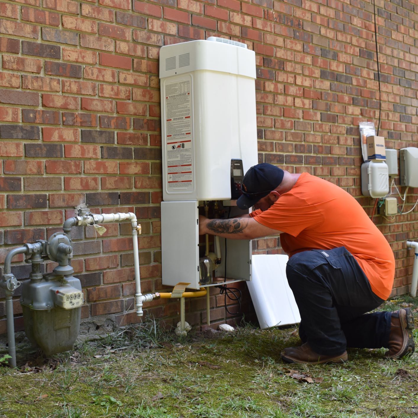 Estes Plumber installing a Tank Less Water Heater 