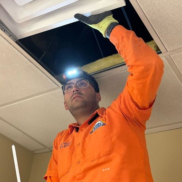 Estes Commercial Service Technician performing maintenance