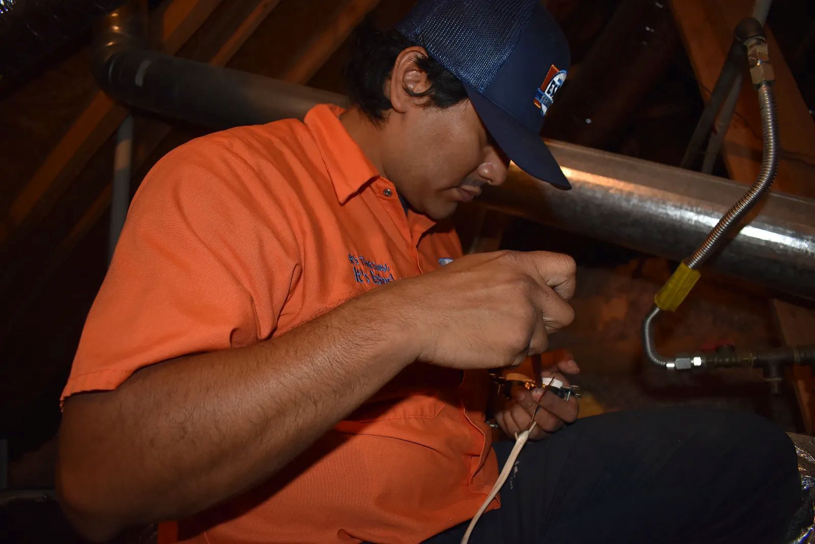 Estes Services Technician working in a Carrier Furnace