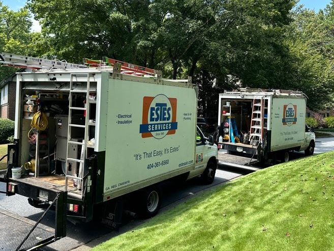 Two Estes Services Trucks on the street in Dunwoody, GA