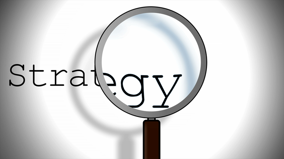 magnifying glass on the word strategy