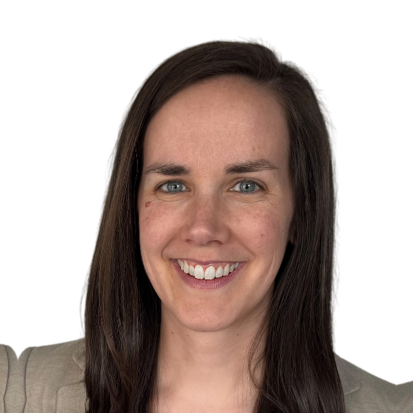 Smiling woman with long dark hair wearing a beige blazer against a white background