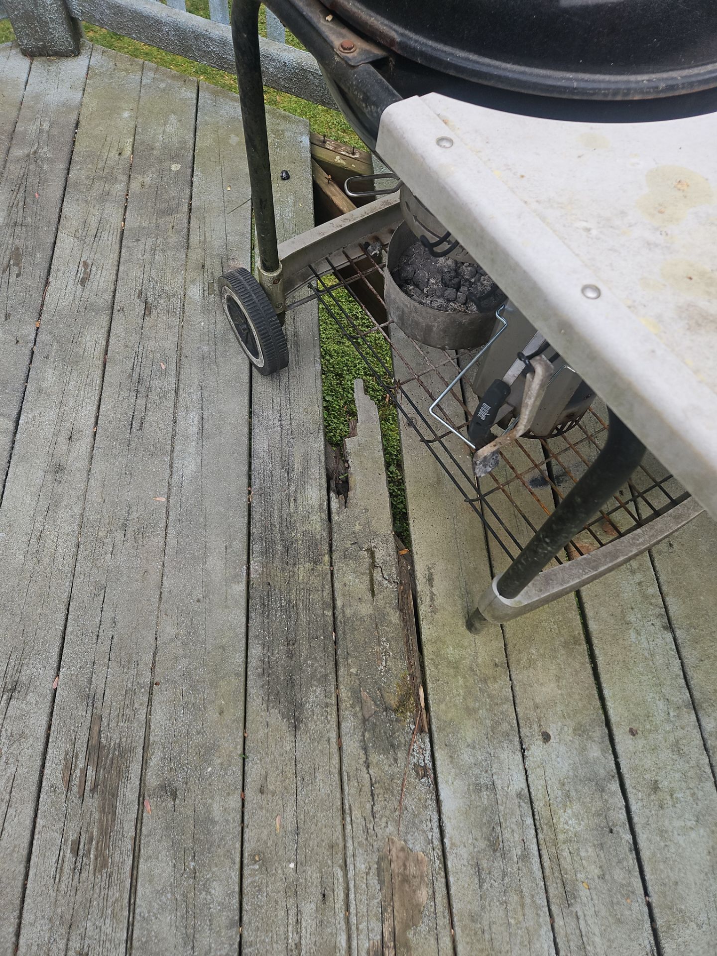 Damaged deck boards near grill how to tell if deck boards need replaced service in Marietta GA by Nelson Exteriors