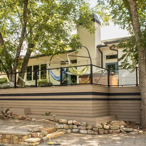 Modern raised deck installation with composite wood and hammock seating by Nelson Exteriors in Atlanta, GA