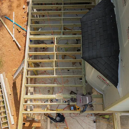 Expert contractors performing deck installation for a home renovation project by Nelson Exteriors in Atlanta, GA
