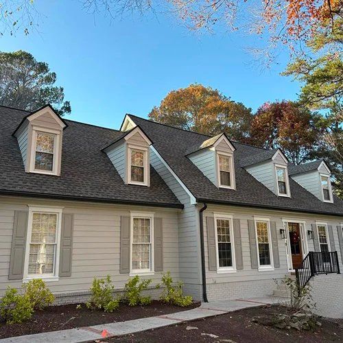 Exterior view of home with new roof and siding after instant roof quote by Nelson Exteriors in GA