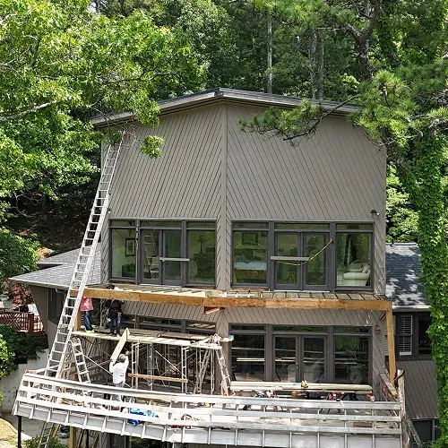 Outdoor dining area on a two-tier deck by Nelson Exteriors in Marietta