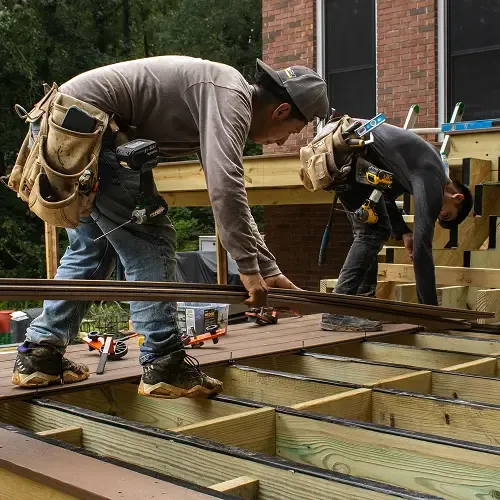 Skilled contractors performing deck installation by Nelson Exteriors in Atlanta, GA