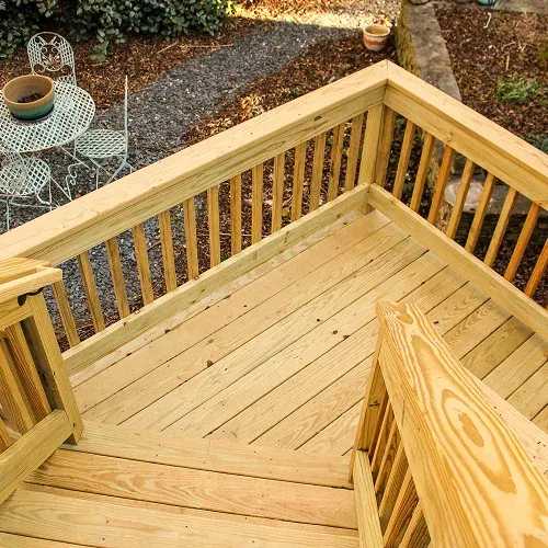 Newly constructed wooden deck with railing showcasing professional deck installation by Nelson Exteriors in Metro Atlanta