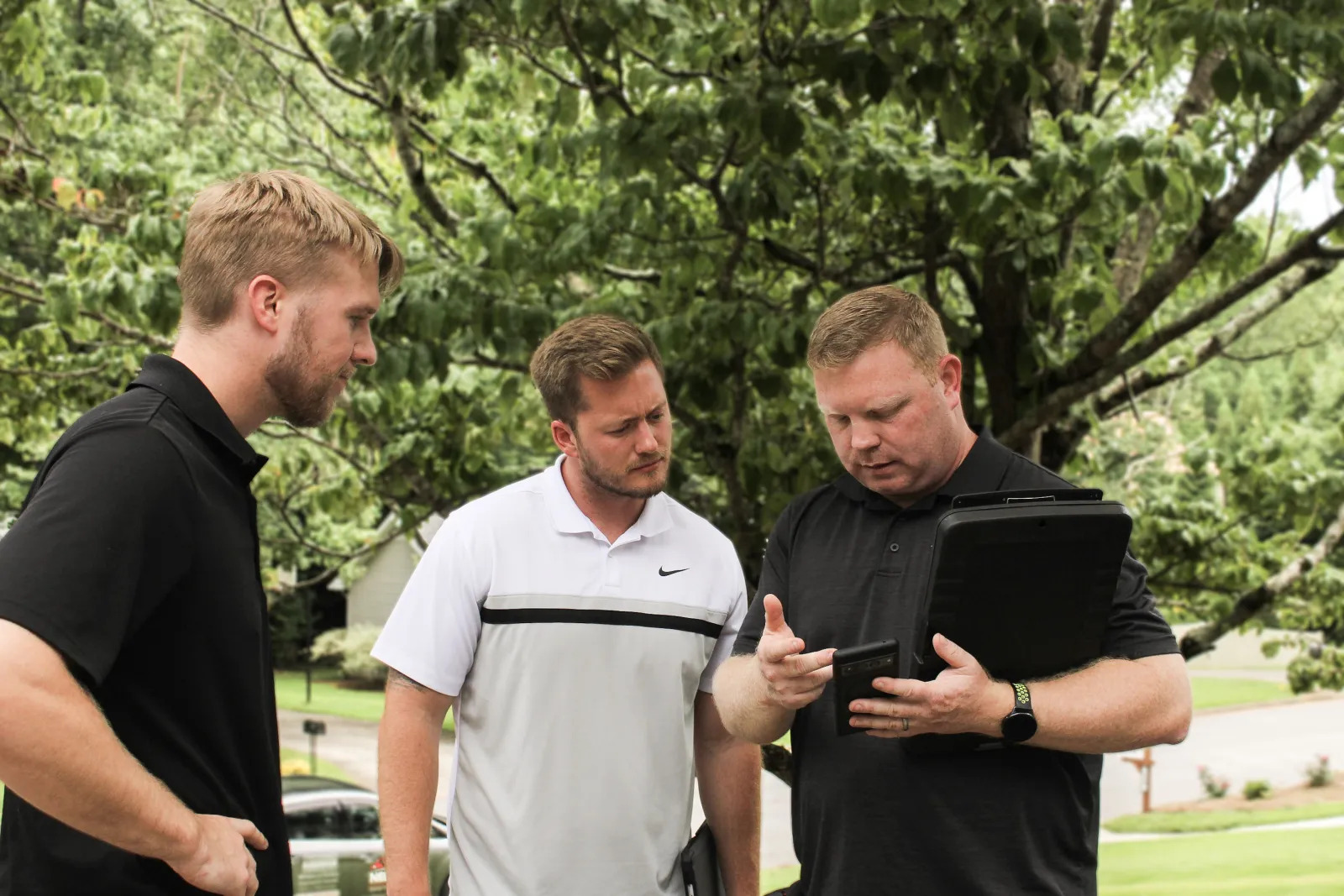 Nelson Exteriors team consultation during siding installation process in Marietta, GA by Nelson Exteriors