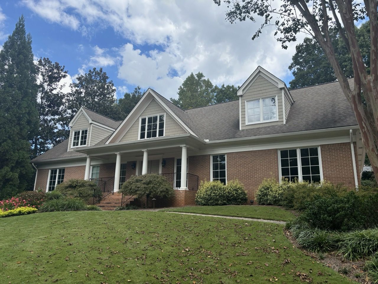 brick and tan home window replacement in atlanta