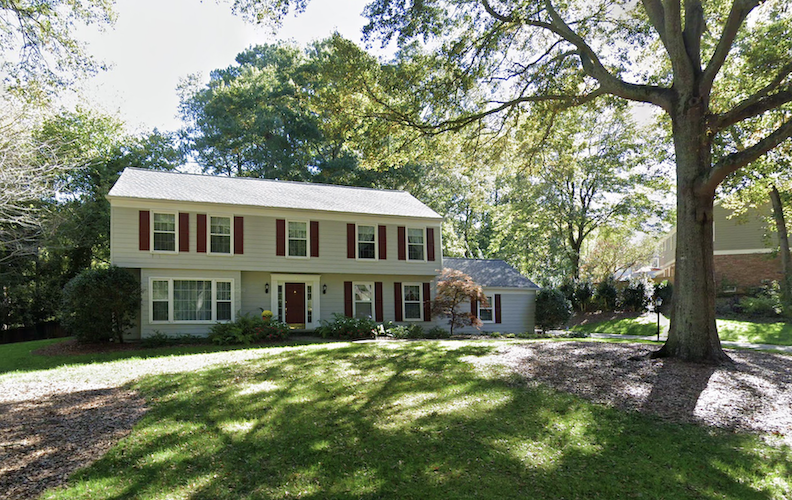 Before: home pictured above with vinyl replacement windows