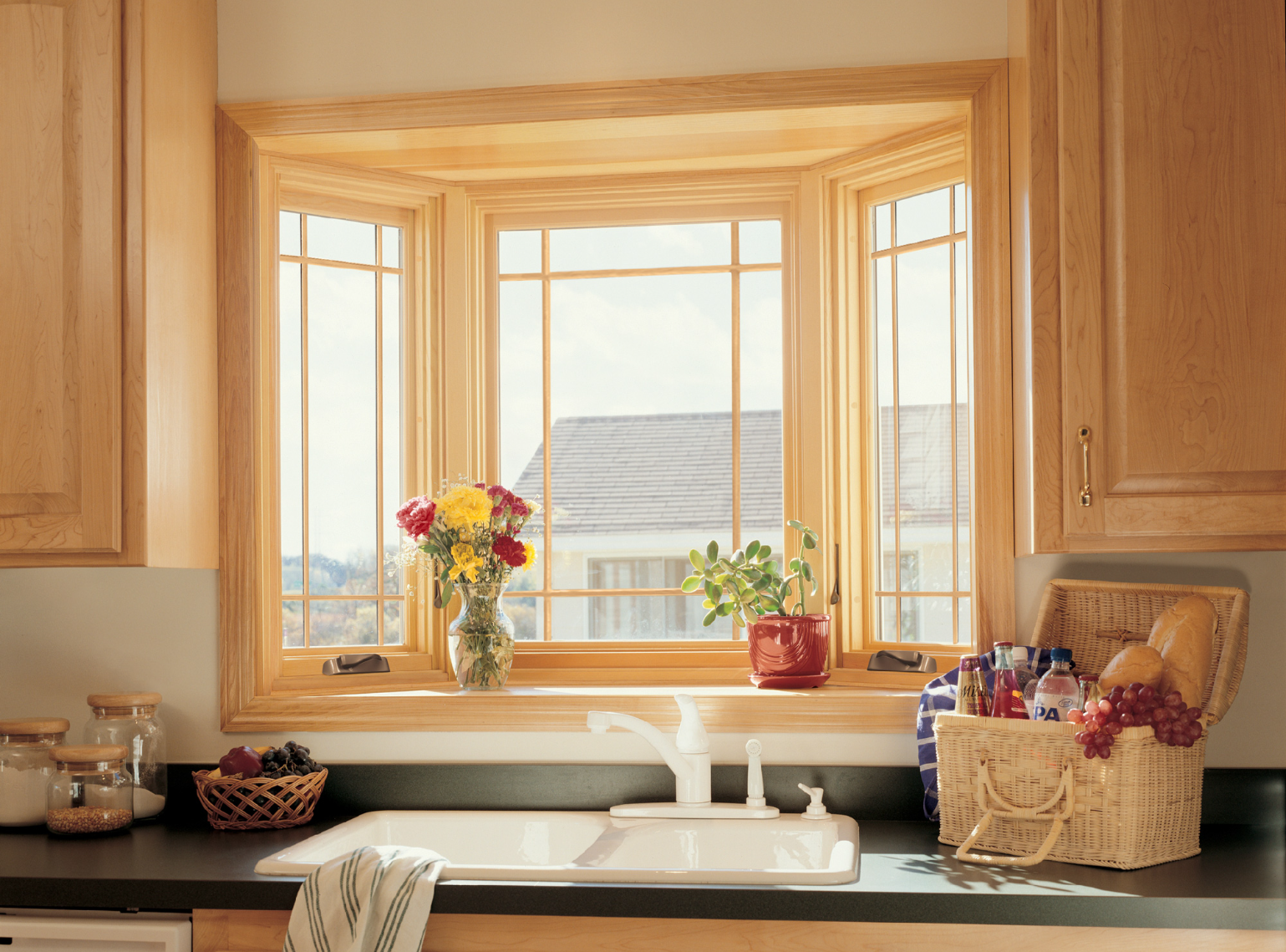 Bay window installed in a kitchen over a sink.