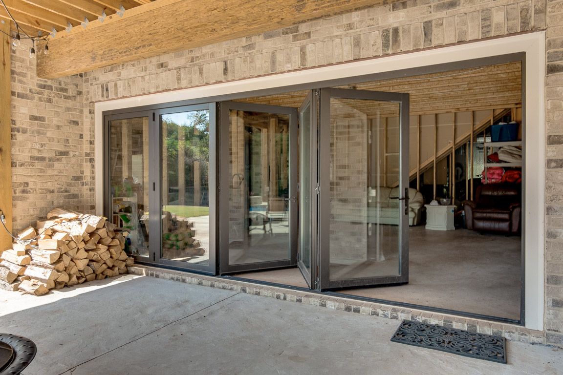 Eurowall Multislide door opening on a patio entertainment space.