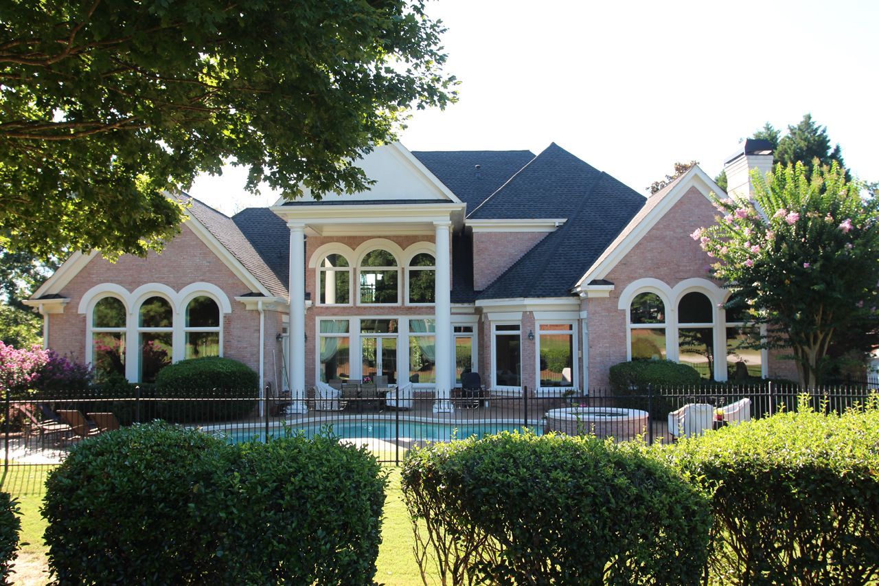 Large arched windows on a suburban home