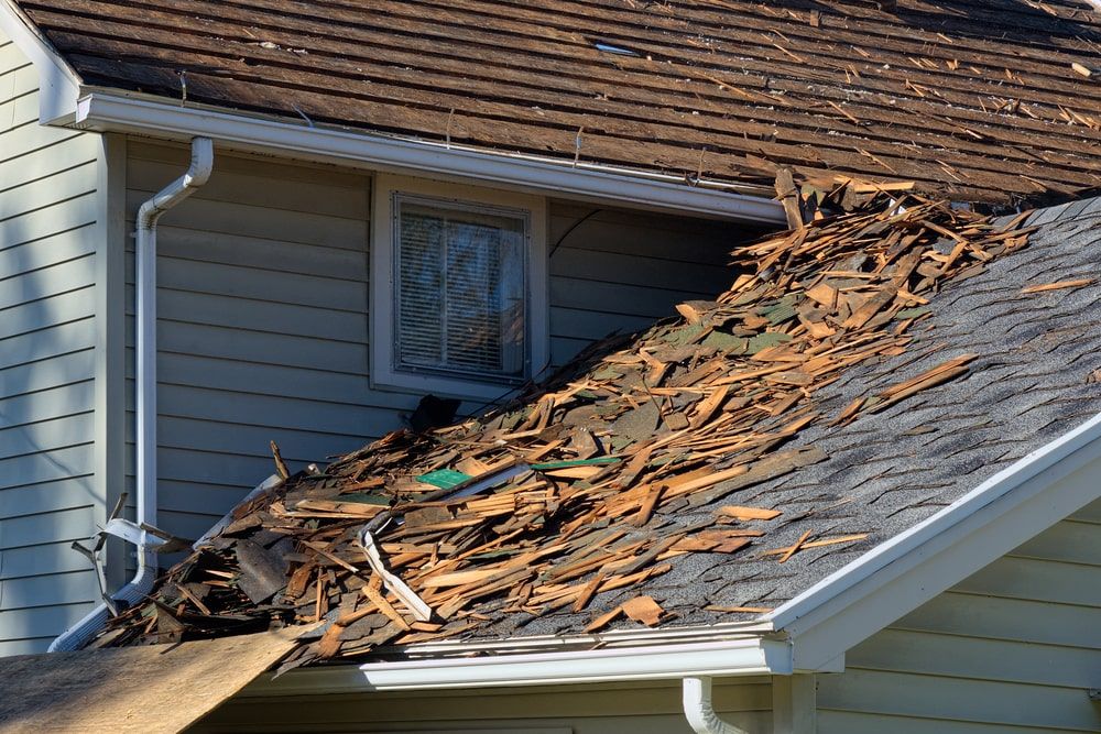 wind damage to roof and roof debris