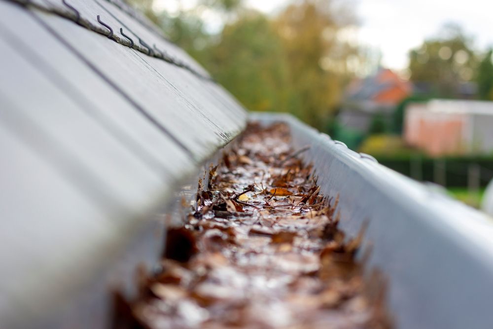 clogged gutters are a common cause of roof leaks