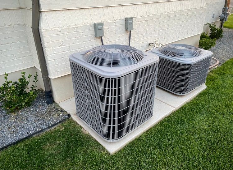 Two Air Conditioner Outdoor Units of Unequal Size