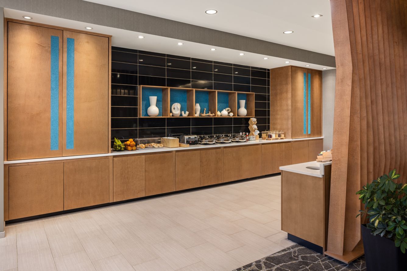 SpringHill Suites by Marriott Custom Breakfast Area Cabinetry, Weave Wall, and Custom Quartz Counters