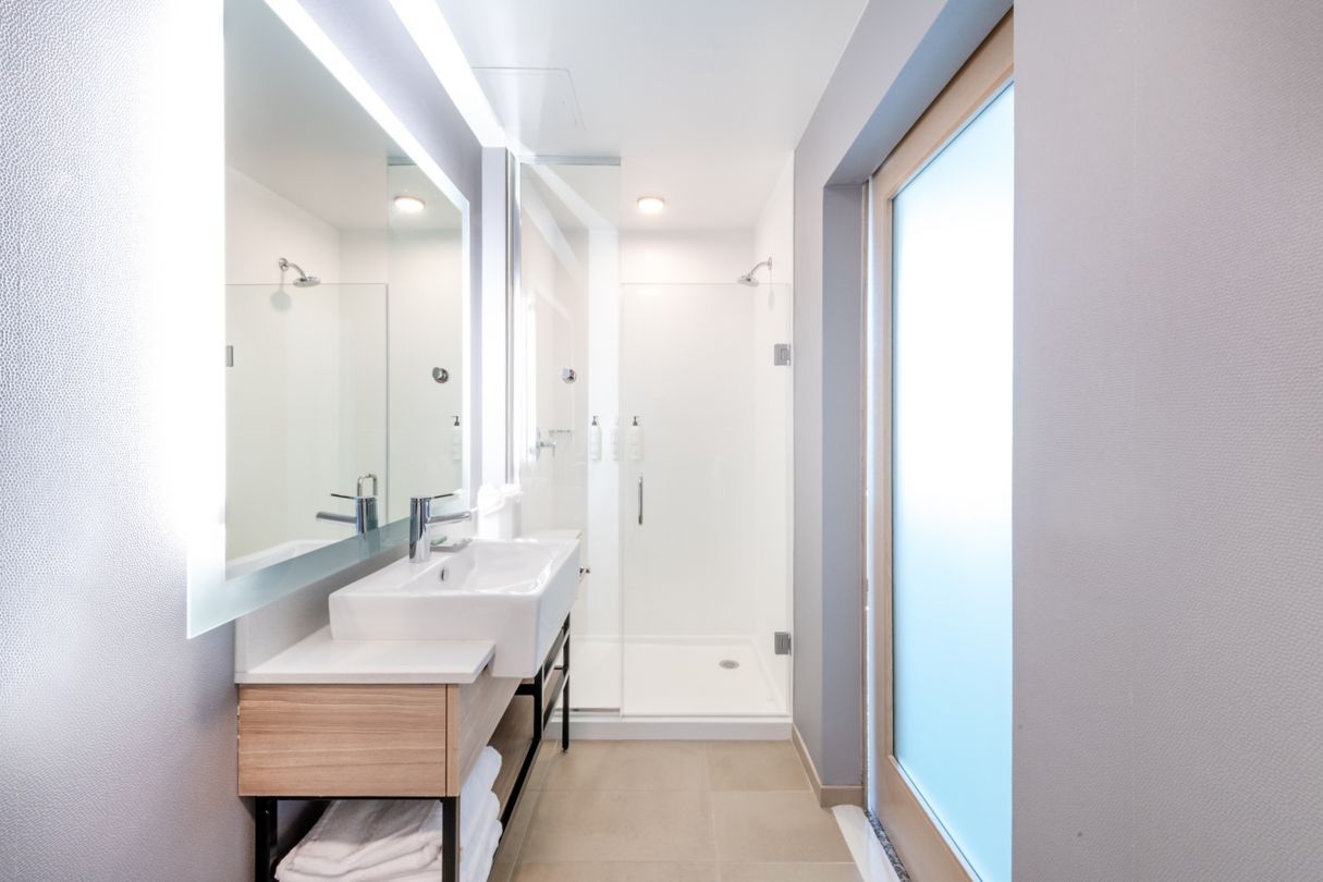 Springhill Suites by Marriott Hotel Guestroom Vanity, Shower Surrounds, Shower Pan, Shower Door, and Barn Door