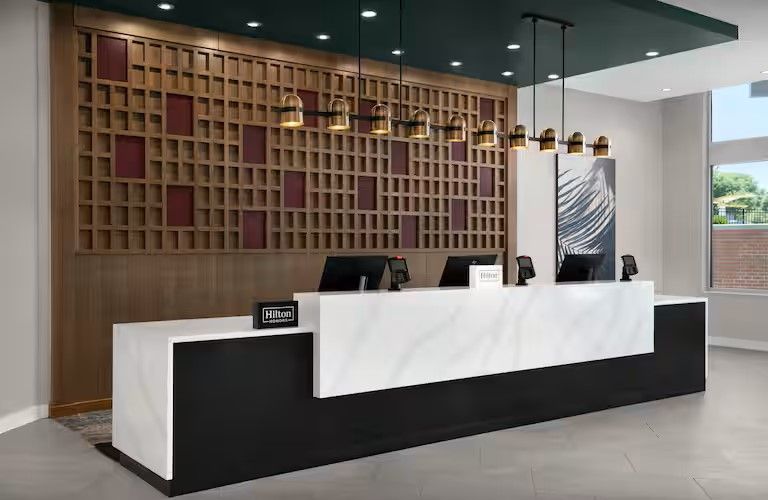 Homewood Suite & Tru by Hilton Custom Front Desk Millwork Wall and Desk