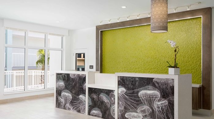 Hilton Garden Inn Custom Front Desk Millwork and Quartz Countertops