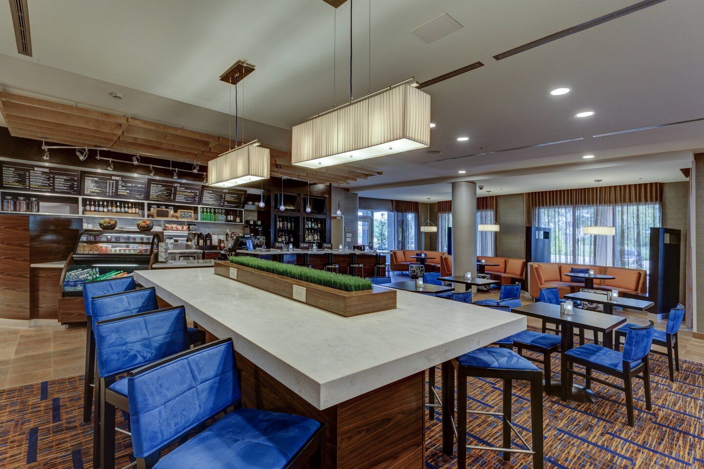 Courtyard by Marriott Custom Communal Table Quartz and Marketplace Millwork