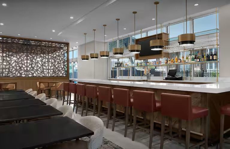 Homewood Suites & Tru by Hilton Custom Bar and Millwork Wall