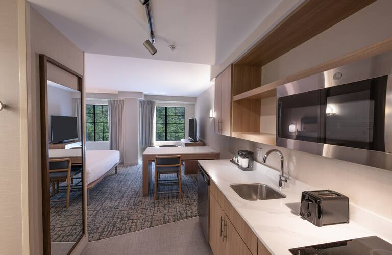 Homewood Suites by Hilton Hotels Guestroom Suite Custom Kitchen Cabinetry, Quartz Counters, and Windowsills