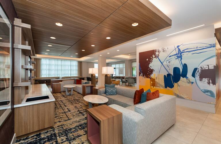 Homewood Suites by Hilton Hotels Custom Millwork Entertainment Wall and Custom Ceiling Feature in Lobby