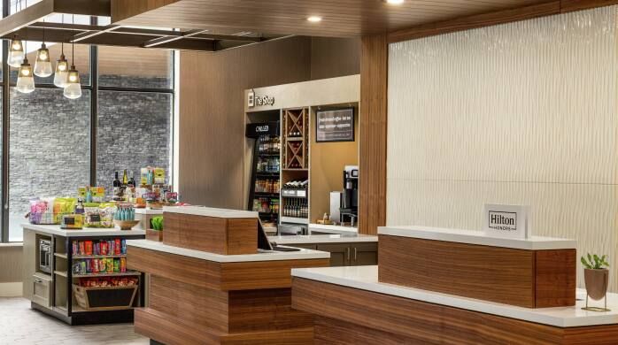 Hilton Garden Inn Custom Registration and Market Millwork and Quartz