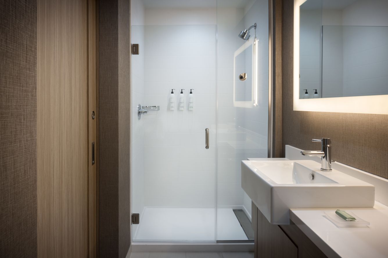 Springhill Suites by Marriott Custom Bathroom Barn Door, Vanity Millwork and Countertops