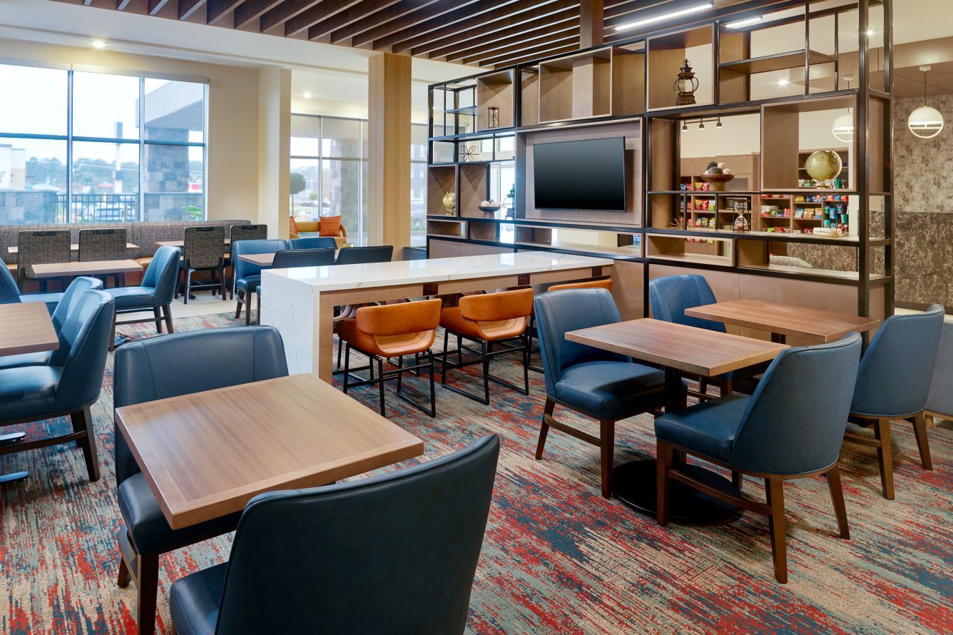 TownePlace and Springhill Suites Dual Brand by Marriott Custom Public Area Communal Table and Wood Slat Ceiling